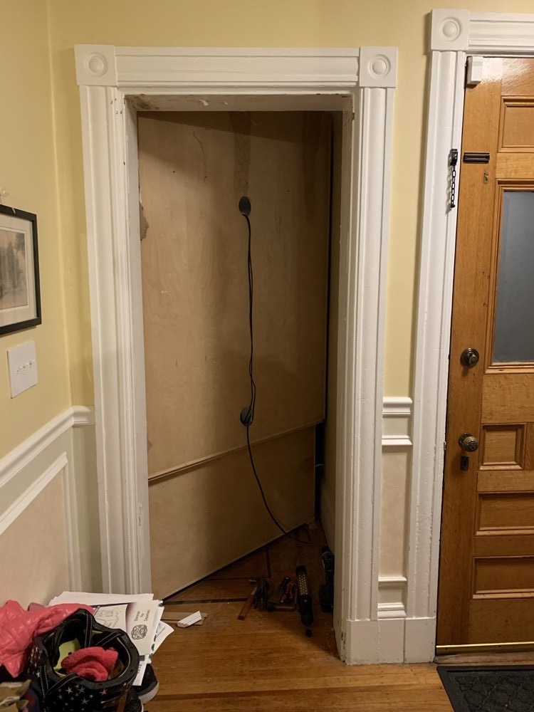 Empty entryway opening before closet shelving
