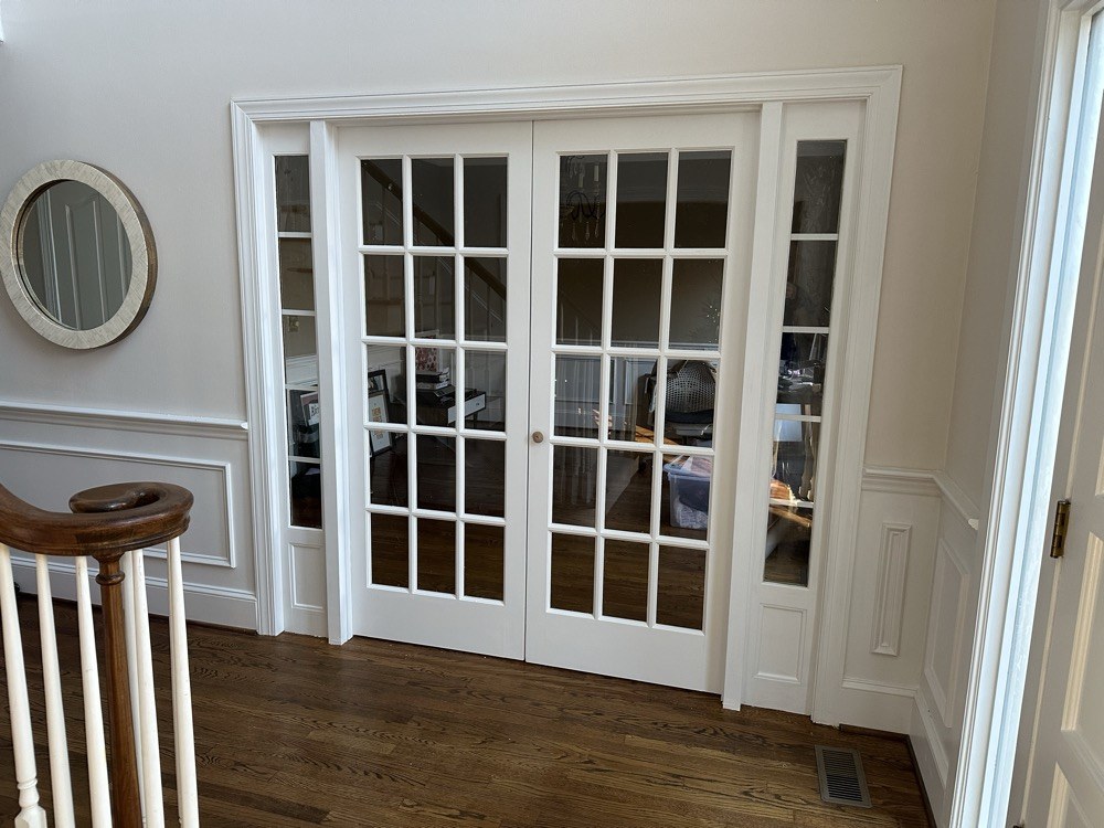 Completed French doors and sidelights enclosing the home office