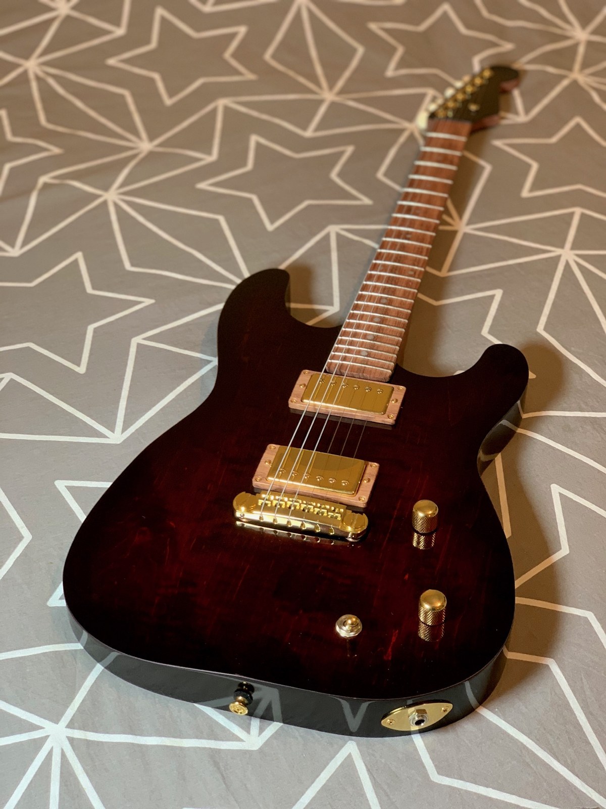 Completed deep red guitar with gold hardware