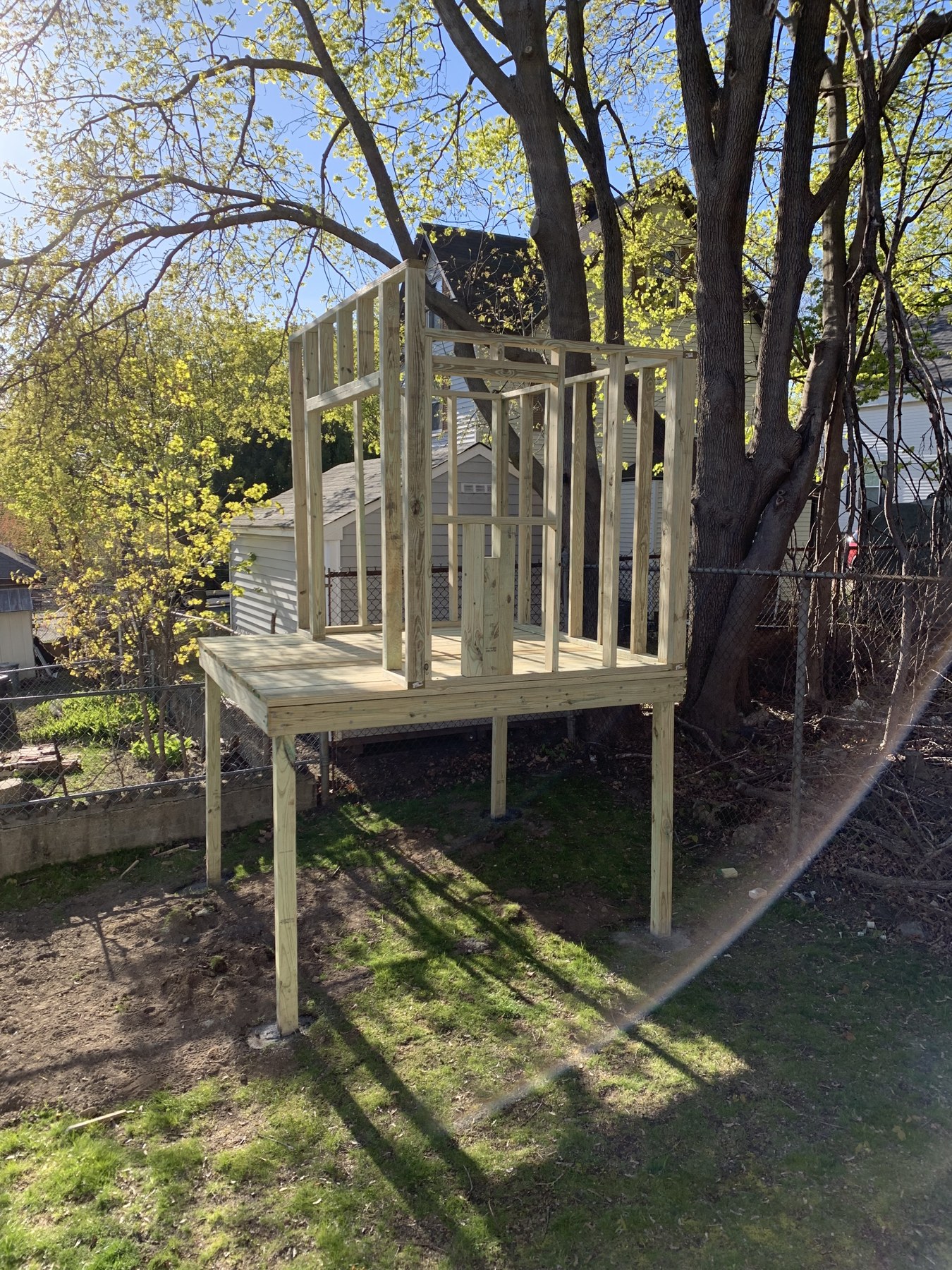 Playhouse wall framing and roof framing on the raised deck